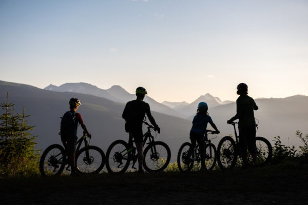 A family out mountain biking through British Columbia's wilderness