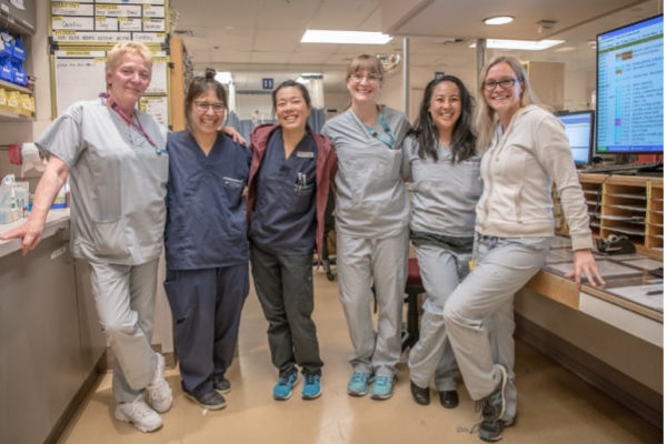 Providence health care nurses in scrubs, smiling and happy