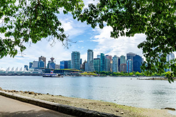 view of downtown Vancouver near seawall with water and tall buildings in the background